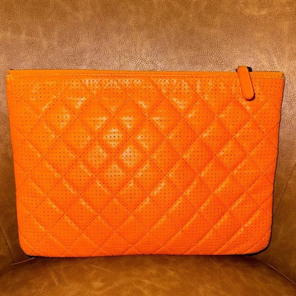 Chanel orange perforated quilted leather O case clutch pouch NWOT